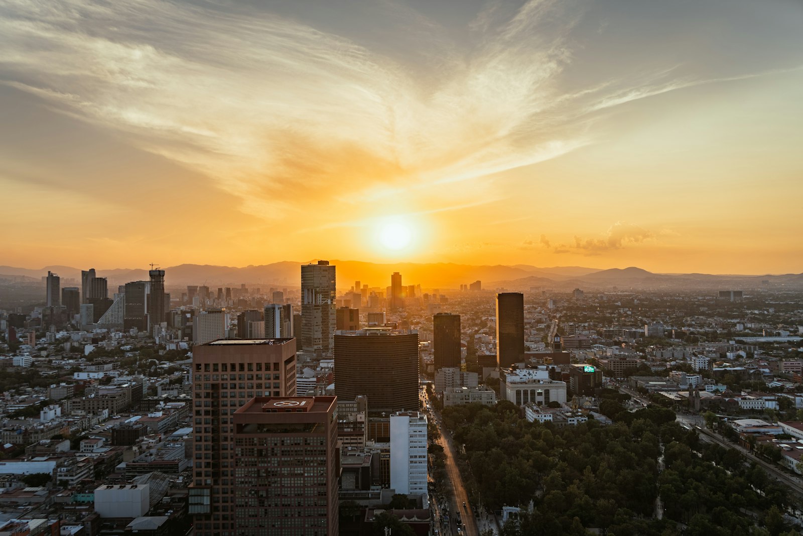 Mexico City skyline with high-rise buildings at sunset